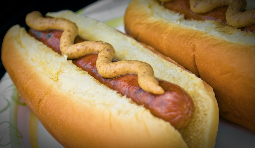 Image of a hot dog with mustard